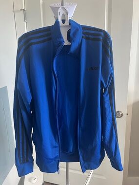Adidas women’s blue Track Jacket with Black Stripes